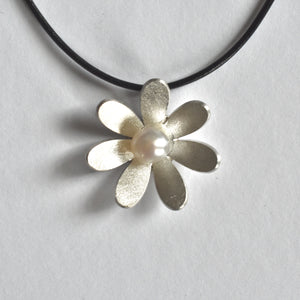 Domed daisy and pearl necklace on leather cord