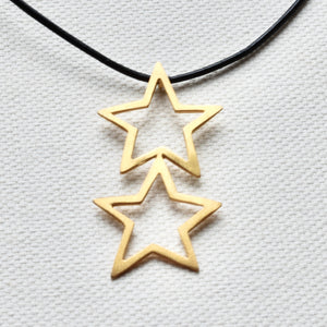 Gold plated stars on leather