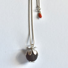 Domed daisies and a lava stone necklace