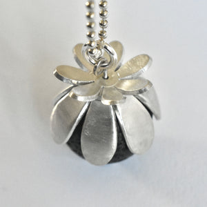 Domed daisies and a lava stone necklace