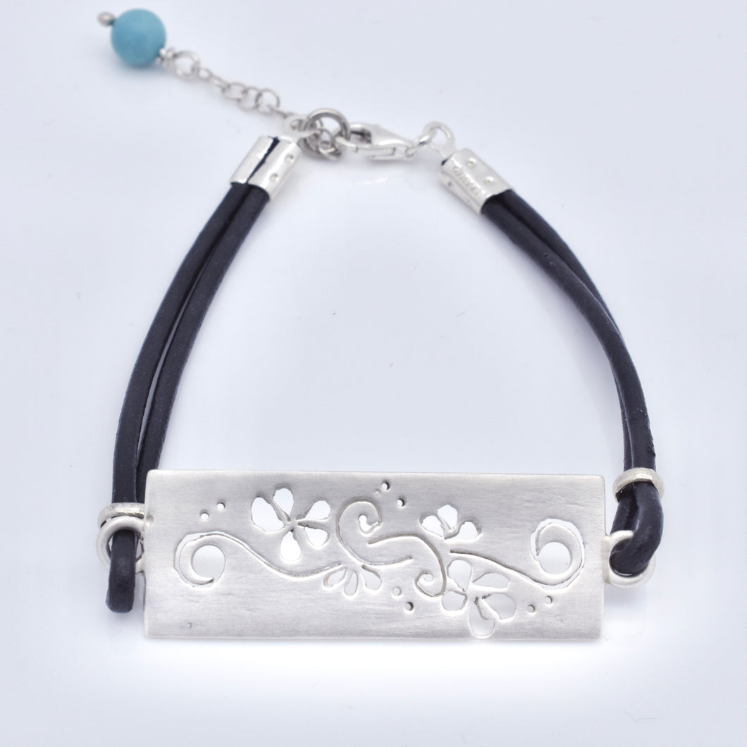 Handmade Ornament Motif On Black Leather Bracelet With A Turquoise