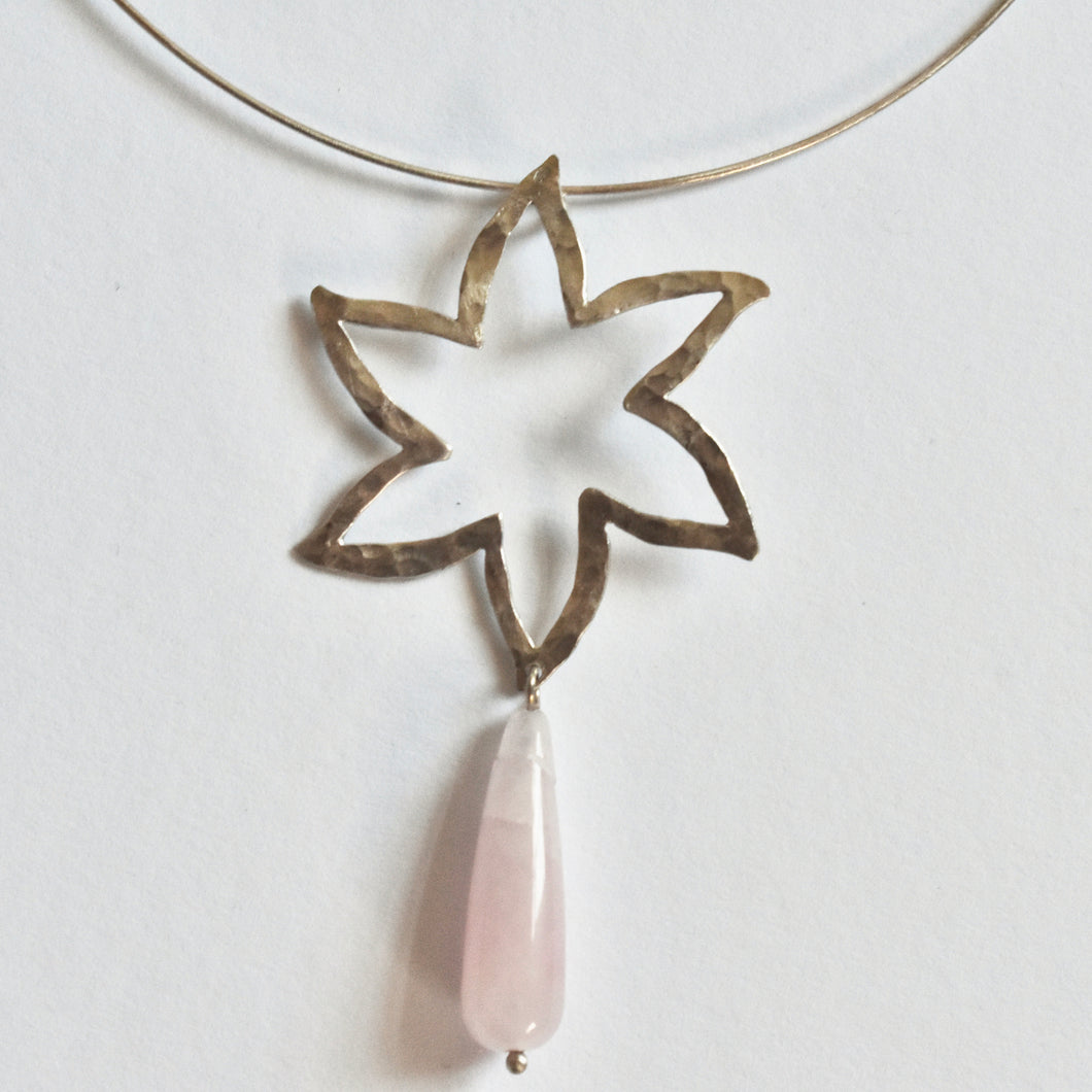 Flower and a pink quartz on silver cord