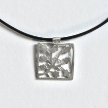 Leaf pattern necklace on leather cord