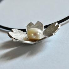 Domed sakura and pearl necklace on leather cord
