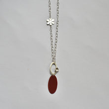 Necklace with silver enamelled dark orange oval piece and daisies